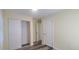 Bedroom with sliding door closet and wood-look floors at 1940 Quince St, Denver, CO 80220