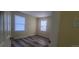 Well-lit bedroom with wood-look floors and window blinds at 1940 Quince St, Denver, CO 80220