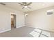 Bright bedroom with carpet flooring and ensuite bathroom at 21278 E 63Rd Dr, Aurora, CO 80019
