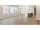 Open concept dining area with hardwood floors and an island at 21278 E 63Rd Dr, Aurora, CO 80019