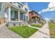 Two story home on a tree lined street with a walkway at 21278 E 63Rd Dr, Aurora, CO 80019