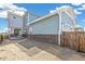 Exterior view of two-story house with backyard and detached garage at 21278 E 63Rd Dr, Aurora, CO 80019