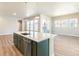 Modern kitchen with island and stainless steel appliances at 21278 E 63Rd Dr, Aurora, CO 80019