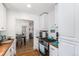 Open kitchen with white cabinets, wood countertops, and stainless steel appliances at 1160 S Monroe St, Denver, CO 80210
