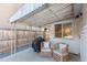 Relaxing patio with covered seating area, grill, and comfortable wicker chairs at 1160 S Monroe St, Denver, CO 80210