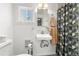 Simple bathroom with shower, toilet, and vanity at 1160 S Monroe St, Denver, CO 80210