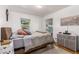 Serene bedroom with a double bed, dresser, and access to hallway at 1160 S Monroe St, Denver, CO 80210