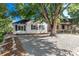 House exterior showcasing landscaping and a large tree at 1160 S Monroe St, Denver, CO 80210