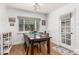 Dining room with wooden table and chairs, and access to the backyard at 1160 S Monroe St, Denver, CO 80210
