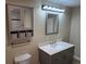 Updated bathroom with gray vanity, quartz countertop, and new fixtures at 140 E Highline Cir # 203, Centennial, CO 80122