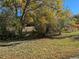 Landscaped area with autumn leaves and trees at 140 E Highline Cir # 203, Centennial, CO 80122