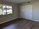 Spacious bedroom with laminate wood flooring and large closet at 140 E Highline Cir # 203, Centennial, CO 80122