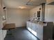 Shared laundry room with several coin-operated machines at 140 E Highline Cir # 203, Centennial, CO 80122