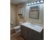 Updated bathroom with gray vanity, quartz countertop, and new fixtures at 140 E Highline Cir # 203, Centennial, CO 80122