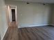Bright hallway with laminate wood floors at 140 E Highline Cir # 203, Centennial, CO 80122