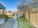 Landscaped backyard with a patio and walkway at 1448 N Williams St, Denver, CO 80218