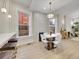 Modern dining area with white table and chairs near kitchen at 1448 N Williams St, Denver, CO 80218