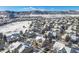 Aerial view of neighborhood with snow covered homes and landscape at 8441 S Lewis Ct, Littleton, CO 80127