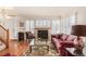 Bright living room featuring a fireplace and hardwood floors at 8441 S Lewis Ct, Littleton, CO 80127