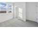 Well-lit bedroom featuring a walk-in closet and expansive windows at 2879 Taryn St, Erie, CO 80026