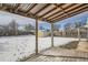 Wooden deck overlooking fenced backyard with shed at 2332 W Baltic Pl, Englewood, CO 80110