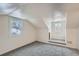 Charming bedroom with gray carpet, two windows and built-in window seat at 2332 W Baltic Pl, Englewood, CO 80110