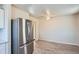 Modern kitchen with stainless steel appliances and white cabinets at 2332 W Baltic Pl, Englewood, CO 80110