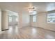 Open concept living room and dining area with vinyl flooring and lots of natural light at 2332 W Baltic Pl, Englewood, CO 80110