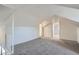 Spacious upstairs bedroom with carpet and access to other rooms at 2332 W Baltic Pl, Englewood, CO 80110