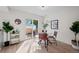 Bright dining area with glass table and leather chairs near sliding doors to a patio at 8447 W Dakota Ave # B, Lakewood, CO 80226