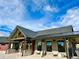 Community clubhouse exterior with stone accents and metal roof at 39710 Congress Cir, Elizabeth, CO 80107