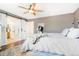 Spacious bedroom with sliding barn doors and en-suite bathroom at 7306 S Nucla St, Aurora, CO 80016