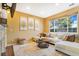 Living room with a neutral color scheme, a sectional sofa, and a brick fireplace at 7306 S Nucla St, Aurora, CO 80016