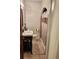 Bathroom with a shower/tub combo, updated vanity, and neutral tile at 1765 S Franklin St, Denver, CO 80210