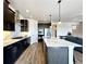 Modern kitchen featuring stainless steel appliances and a large island at 2171 Peralta Loop, Castle Rock, CO 80104