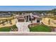 Modern home with expansive driveway and professionally landscaped front yard at 9737 Majestic Oak Dr, Parker, CO 80134
