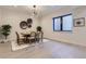 Modern dining area with a wooden table and neutral decor at 9737 Majestic Oak Dr, Parker, CO 80134