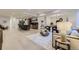 Spacious basement living room with light hardwood floors and comfortable seating at 9737 Majestic Oak Dr, Parker, CO 80134