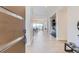 Bright and airy entryway with modern wood door and built-in bar area at 9737 Majestic Oak Dr, Parker, CO 80134