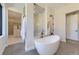 Spa-like bathroom featuring a freestanding tub and walk-in closet at 9737 Majestic Oak Dr, Parker, CO 80134