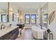 Luxurious bathroom with soaking tub, double vanity, and walk-in shower at 9737 Majestic Oak Dr, Parker, CO 80134