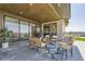 Relaxing covered patio with seating area and views at 9737 Majestic Oak Dr, Parker, CO 80134