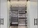 Custom wine cellar with glass doors and stone wall at 9737 Majestic Oak Dr, Parker, CO 80134