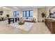 Bright basement sitting area with a comfy sofa and geometric coffee table at 9737 Majestic Oak Dr, Parker, CO 80134