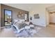 Spacious main bedroom with a neutral color palette and access to backyard at 9737 Majestic Oak Dr, Parker, CO 80134
