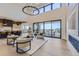 Spacious living area showcasing a contemporary kitchen, high ceilings, and backyard access at 9737 Majestic Oak Dr, Parker, CO 80134