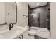 Basement bathroom with a hexagon tile shower and modern vanity at 9737 Majestic Oak Dr, Parker, CO 80134