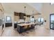 Open concept kitchen with light wood cabinets, modern appliances, and a large island at 9737 Majestic Oak Dr, Parker, CO 80134