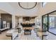 Open concept living room with high ceilings, large windows, and modern seating area at 9737 Majestic Oak Dr, Parker, CO 80134