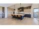 Modern kitchen with sleek cabinetry, quartz countertops, and island seating at 9737 Majestic Oak Dr, Parker, CO 80134